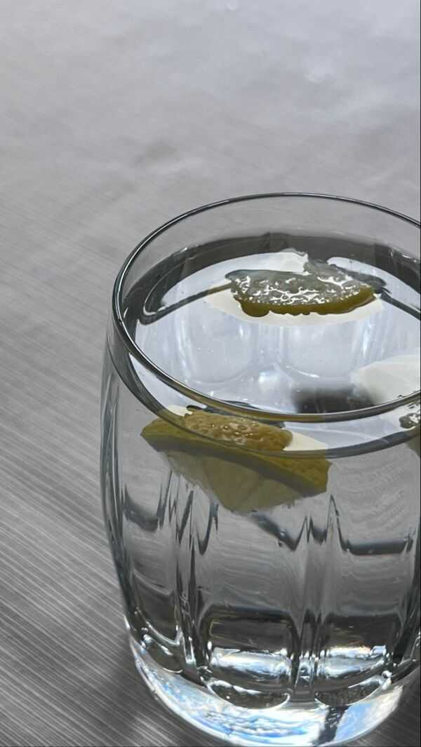 Clear drinking water in a glass on a simple table
